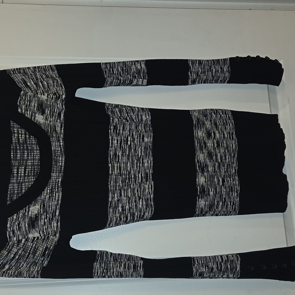 Women's form fitting boat neck sweater.